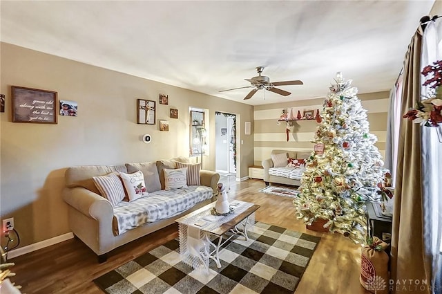 living room with hardwood / wood-style floors and ceiling fan