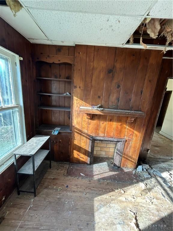 miscellaneous room featuring wooden walls