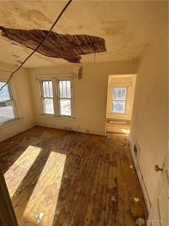 empty room featuring dark wood-type flooring