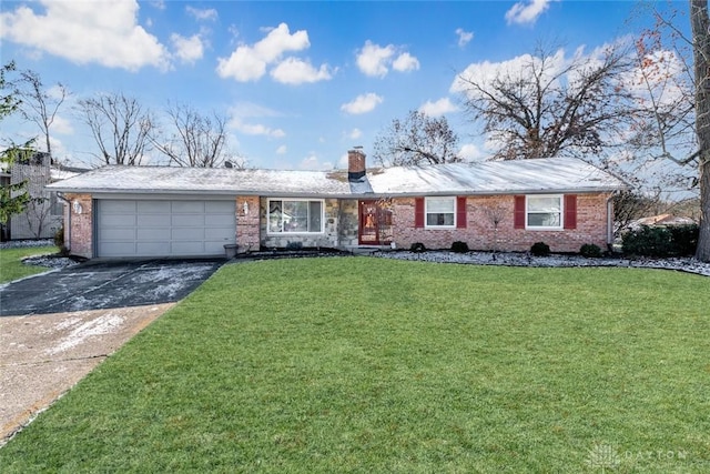 single story home featuring a garage and a front yard