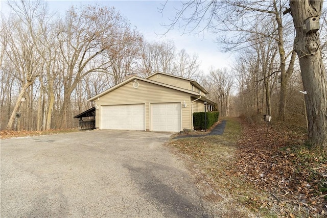 view of side of home with a garage