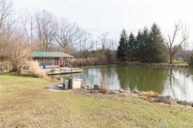 dock area featuring a yard and a water view