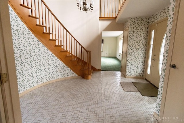 entrance foyer featuring an inviting chandelier