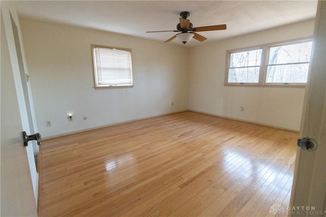 unfurnished room with ceiling fan and light hardwood / wood-style floors