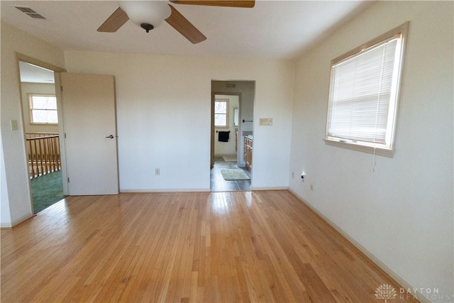 spare room featuring ceiling fan and light hardwood / wood-style flooring