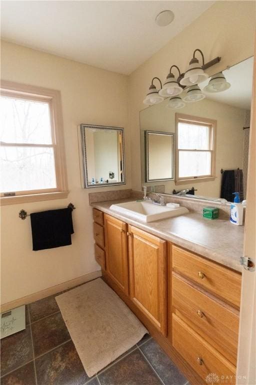 bathroom with vanity, tile patterned floors, and a wealth of natural light