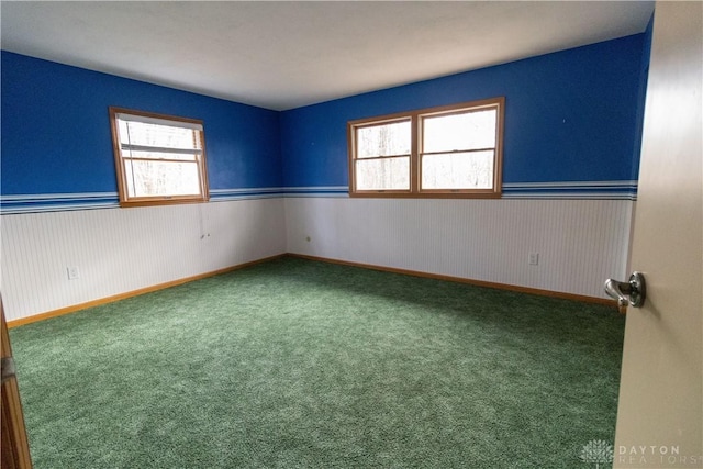 unfurnished room with carpet flooring