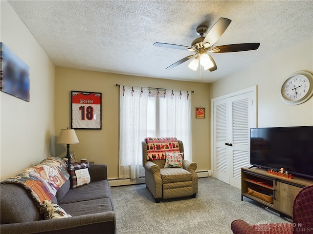 carpeted living room featuring a textured ceiling, baseboard heating, and ceiling fan