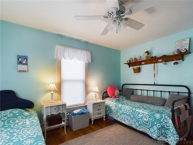 bedroom featuring ceiling fan and hardwood / wood-style flooring