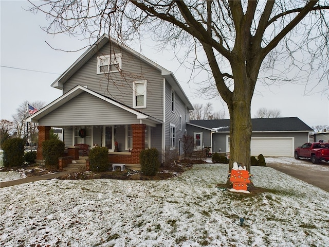 front of property with covered porch and a garage