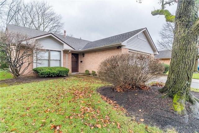 single story home featuring a front yard