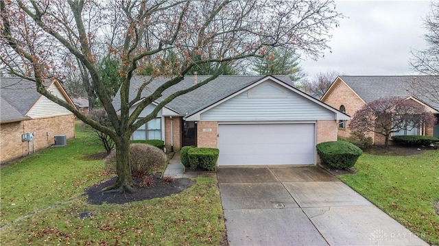 ranch-style home with a front lawn, a garage, and central AC