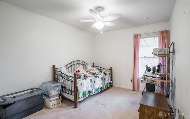 bedroom with light colored carpet and ceiling fan