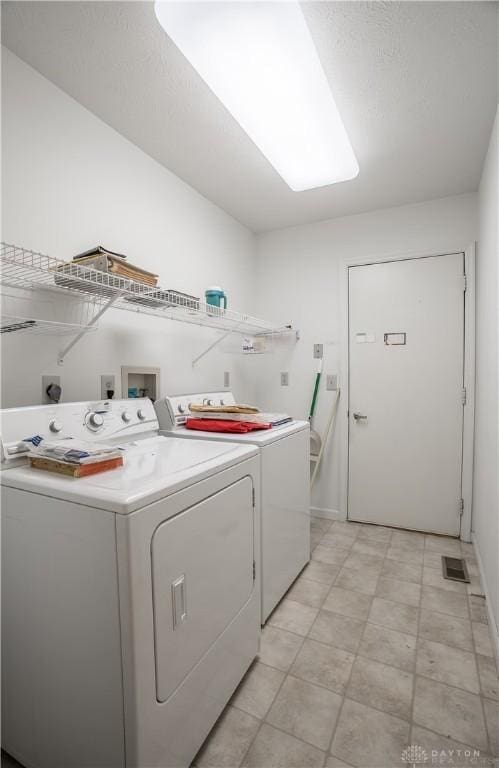 laundry room featuring independent washer and dryer