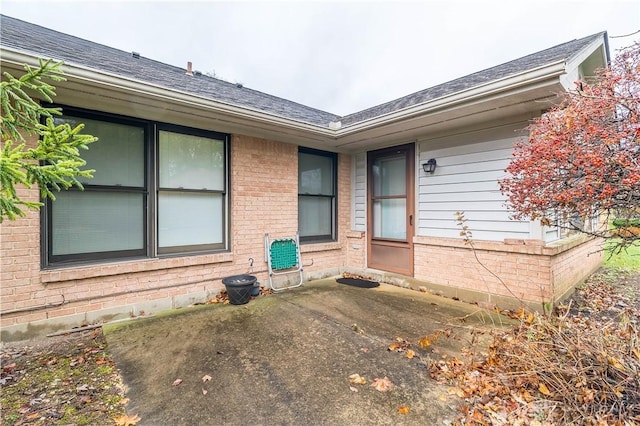 property entrance with a patio area