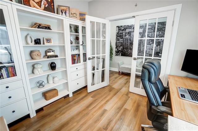 office space featuring french doors and hardwood / wood-style flooring