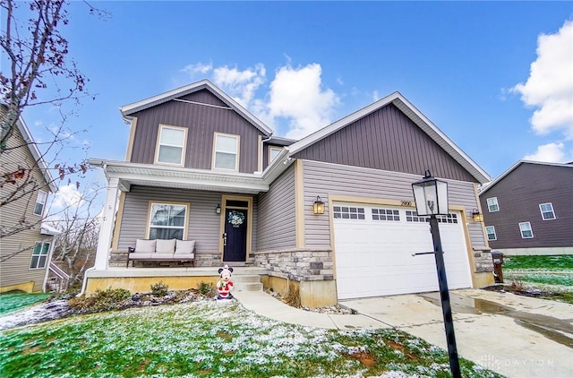 view of front of home with a porch and a garage