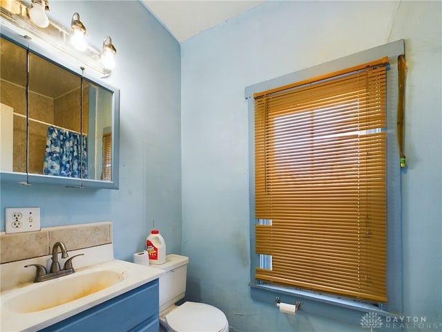 full bath featuring toilet and vanity