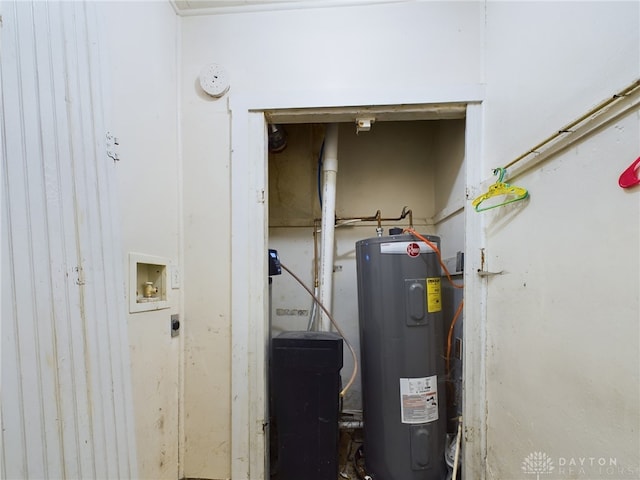 utility room with electric water heater