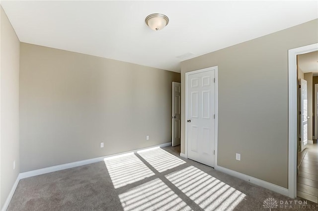 unfurnished bedroom featuring carpet