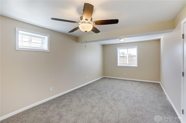 unfurnished room featuring light colored carpet and ceiling fan