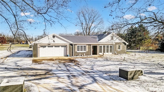 view of front of property with french doors and a garage