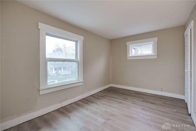 unfurnished room with light hardwood / wood-style flooring