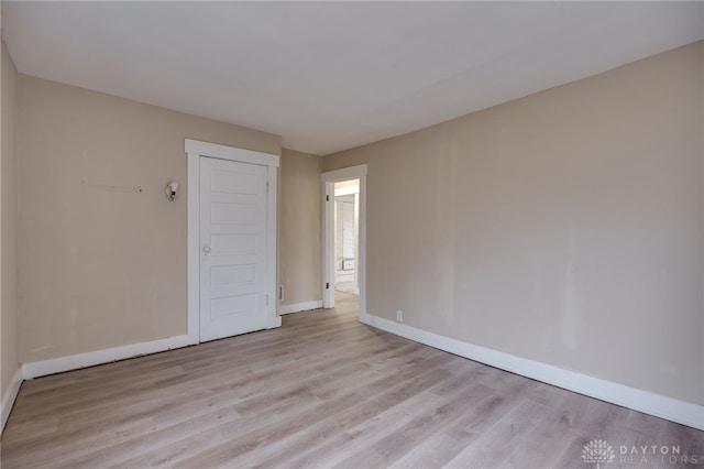 spare room with light hardwood / wood-style floors