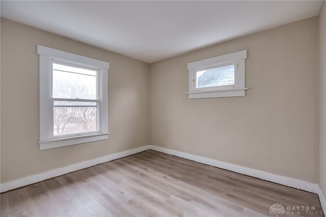 spare room featuring light hardwood / wood-style flooring