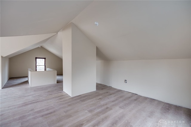 bonus room featuring light hardwood / wood-style floors and lofted ceiling