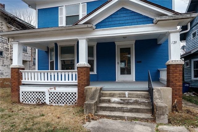 property entrance with covered porch