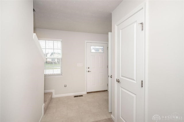 entrance foyer with a textured ceiling