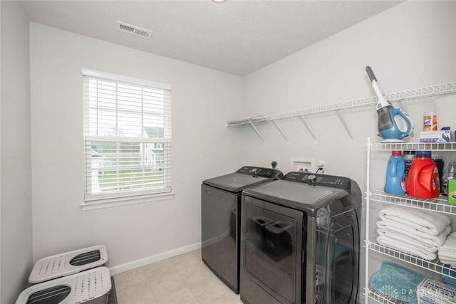 laundry area with a wealth of natural light and independent washer and dryer