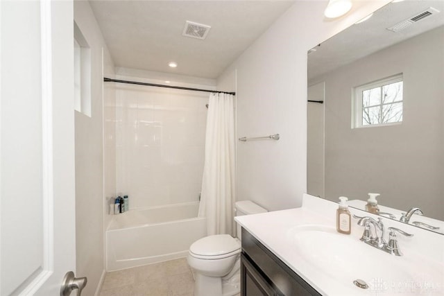 full bathroom with tile patterned flooring, vanity, toilet, and shower / bath combo with shower curtain