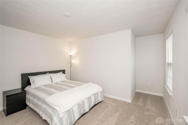 carpeted bedroom with a textured ceiling