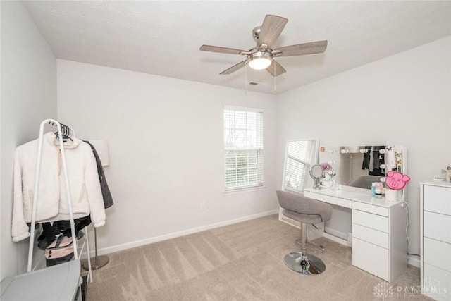 office with light colored carpet and ceiling fan