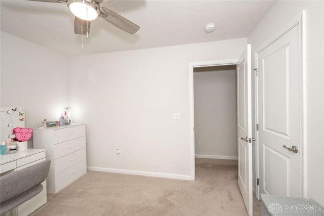 bedroom with light carpet and ceiling fan