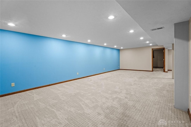 empty room with light colored carpet