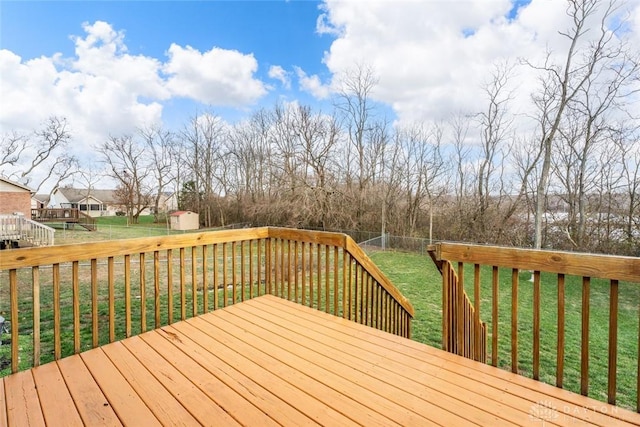 wooden deck featuring a yard