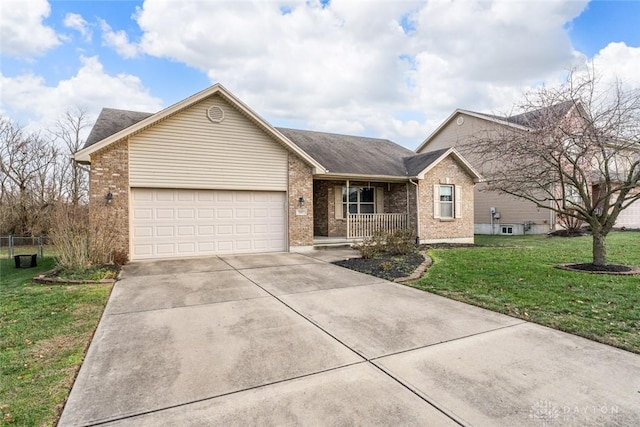 ranch-style house with covered porch, a garage, and a front lawn