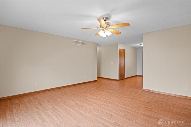 unfurnished room with ceiling fan and light wood-type flooring