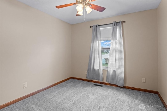 unfurnished room featuring carpet and ceiling fan