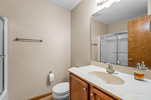 full bathroom with shower / bath combination with glass door, vanity, and toilet