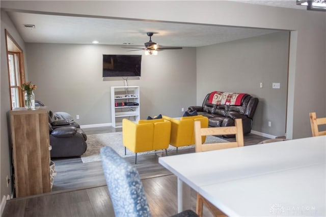 dining space featuring ceiling fan and hardwood / wood-style flooring