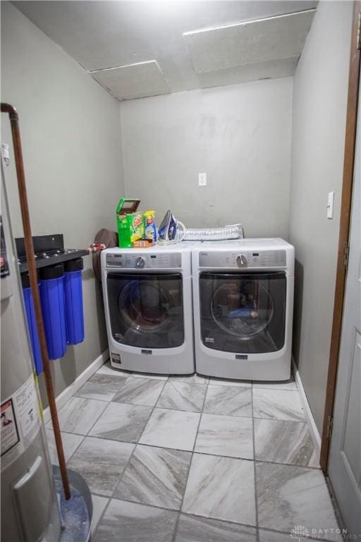 laundry room with washing machine and clothes dryer