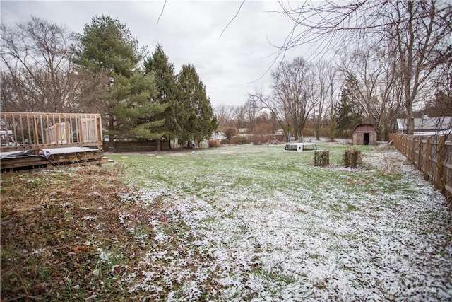 view of yard with a shed and a deck