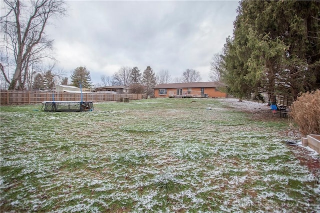 view of yard with a trampoline