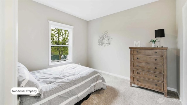 bedroom with light colored carpet