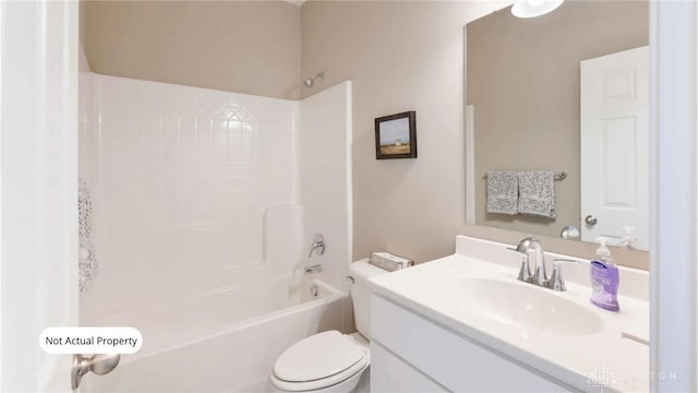 full bathroom featuring vanity, tiled shower / bath combo, and toilet