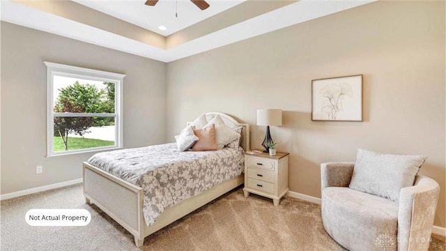 bedroom with ceiling fan and light colored carpet